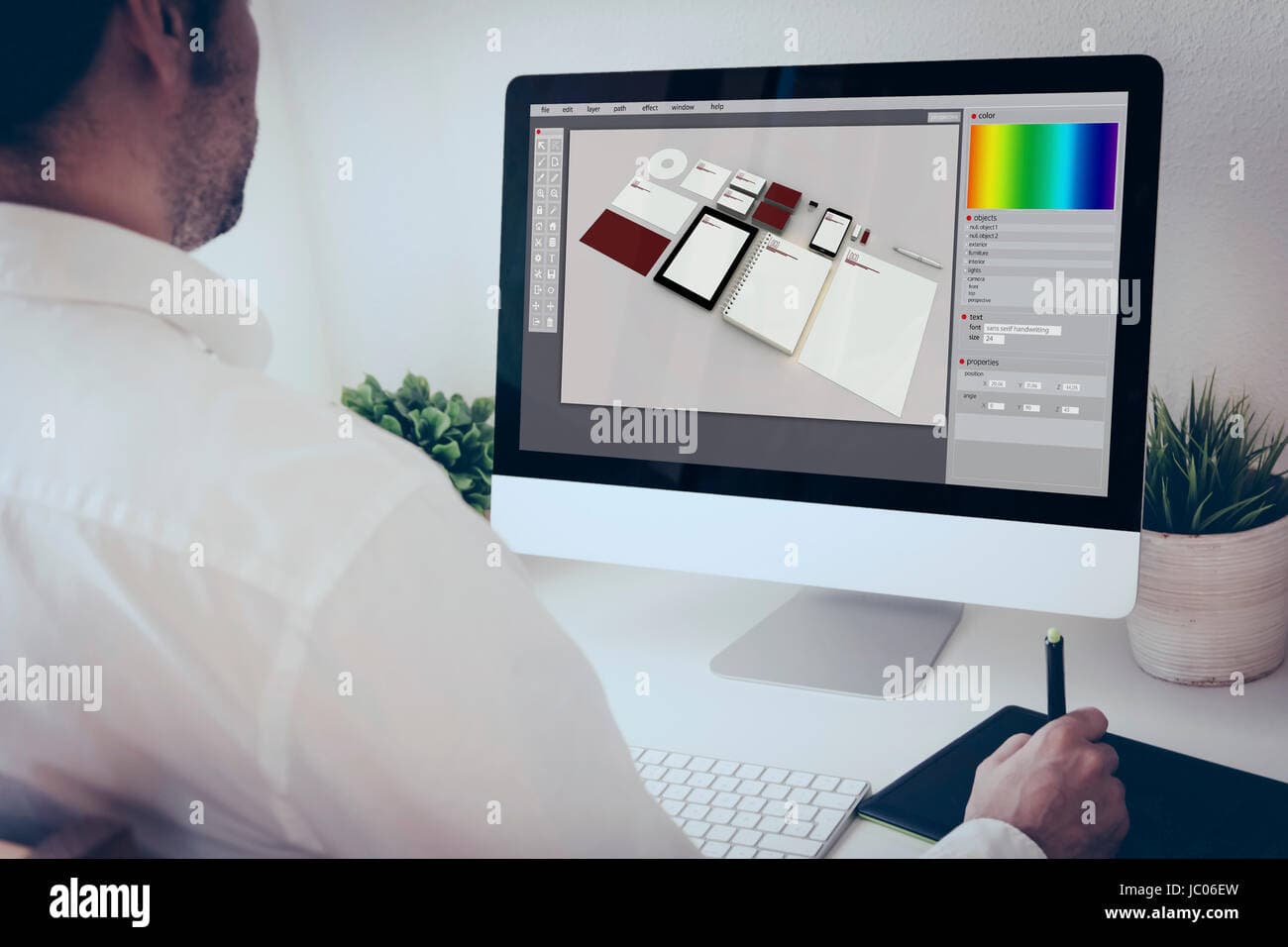 Brand identity and design mockups on a designer's desk